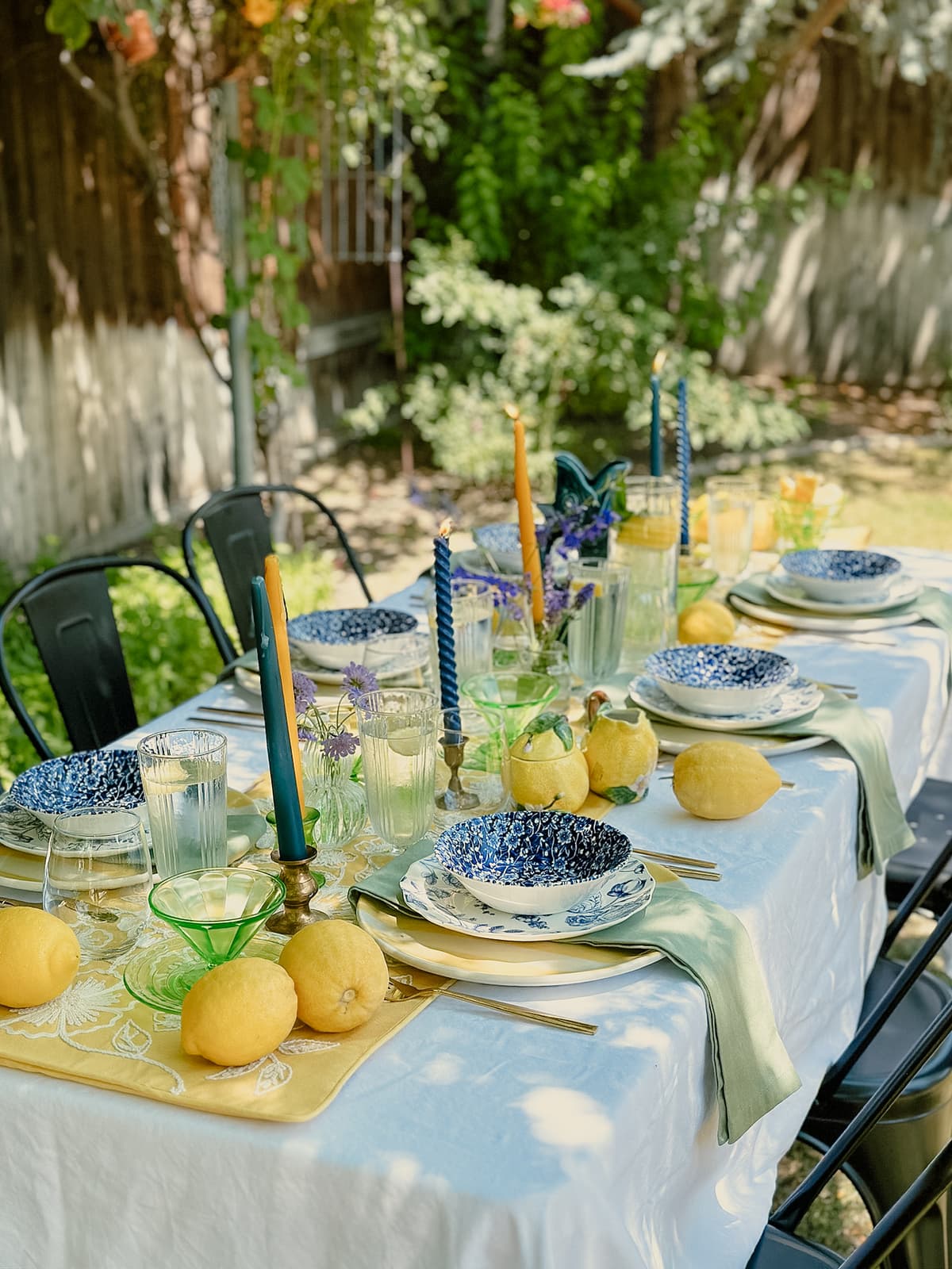Lemon-themed vintage table setting with yellow china, lemon centerpiece, and rustic decor for intimate gathering in Bakersfield