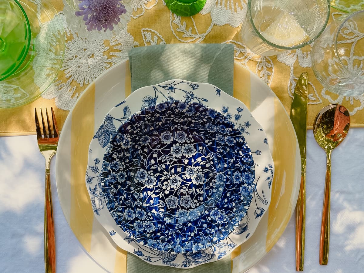 Lemon-themed vintage table setting with yellow china, lemon centerpiece, and rustic decor for intimate gathering in Bakersfield